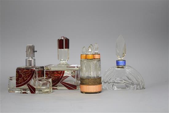 An Eastern European ruby overlaid glass scent flask and matching casket, a cut glass scent bottle with blue enamelled collar and